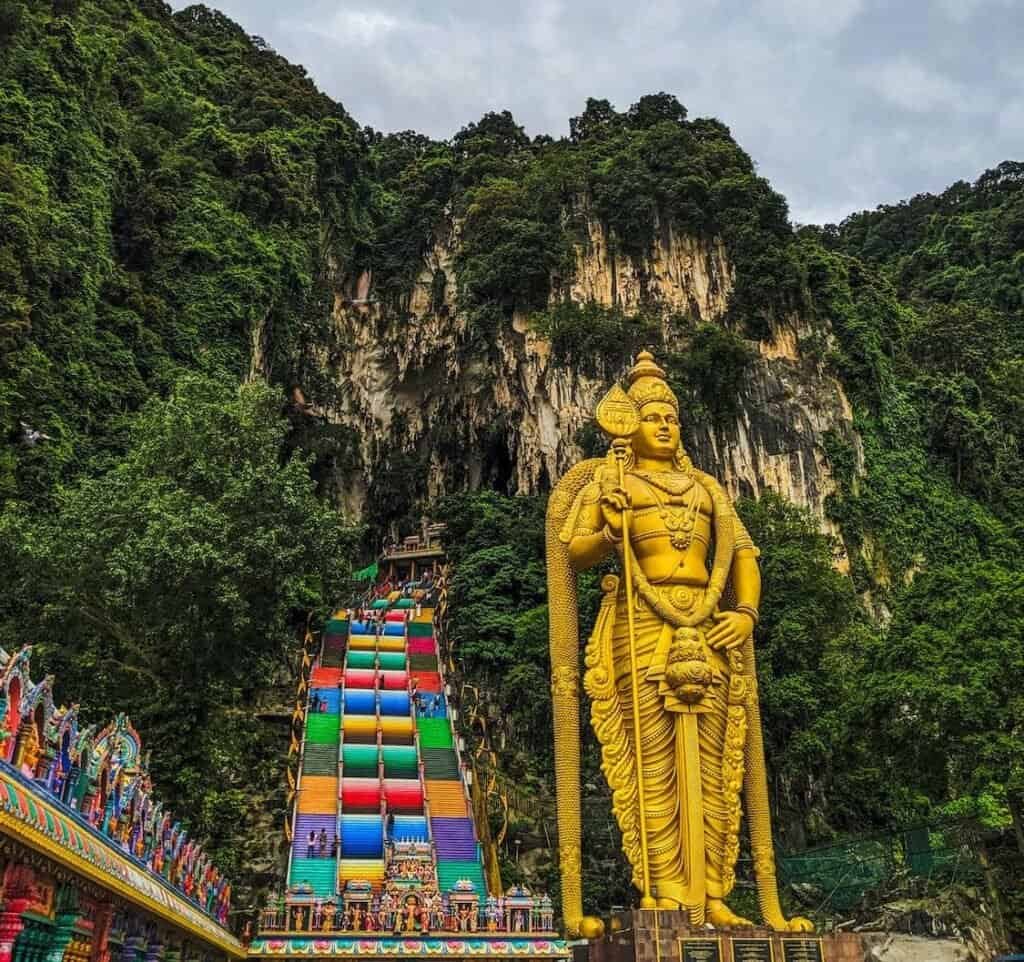 Batu1 The Batu Caves in Kuala Lumpur, a religious site with towering golden statue and caves